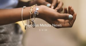 black woman's hands with bracelets on her wrist and text overlay that says precious metal news for the week of march 2nd 2021